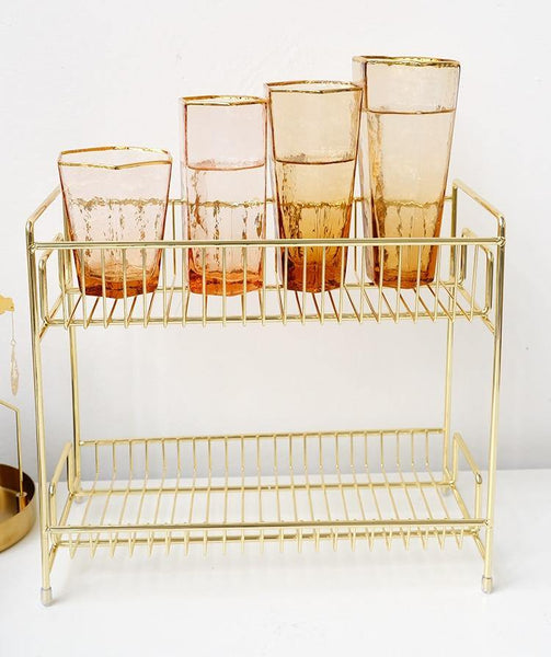 a close up of a cage filled with lots of cups 