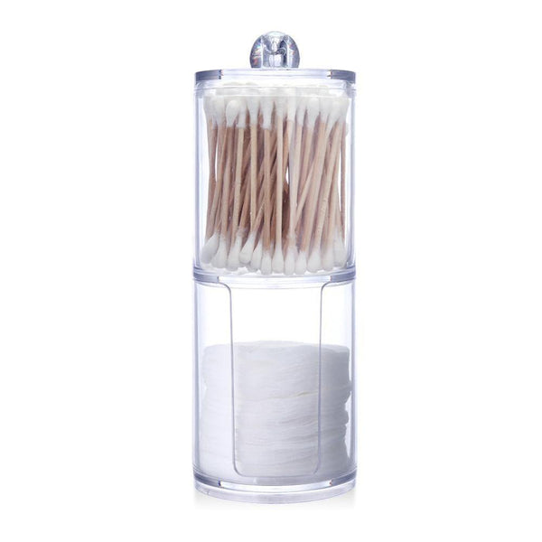 a glass jar with a toothbrush in it 