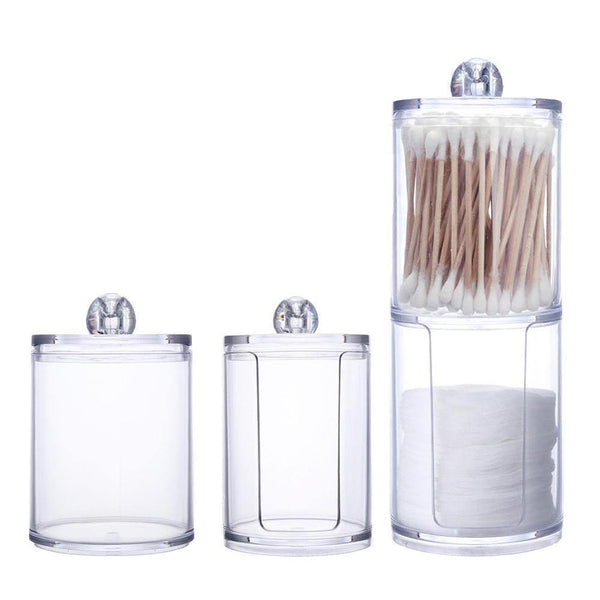 a couple of glass vases sitting on top of a counter 