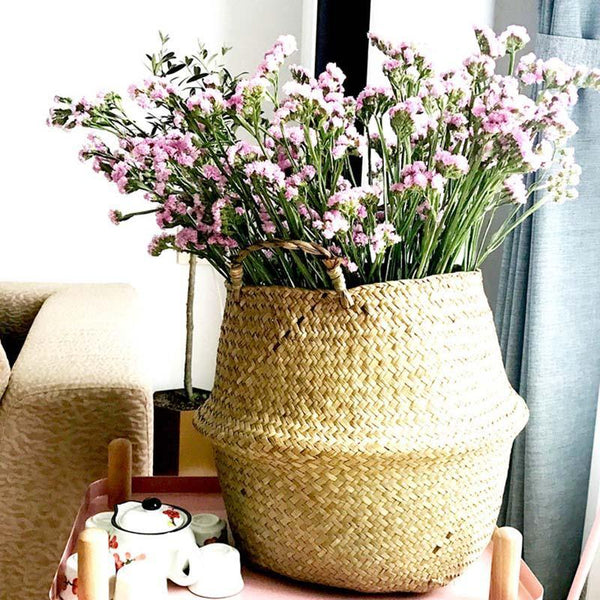 a vase of flowers sitting on a table 